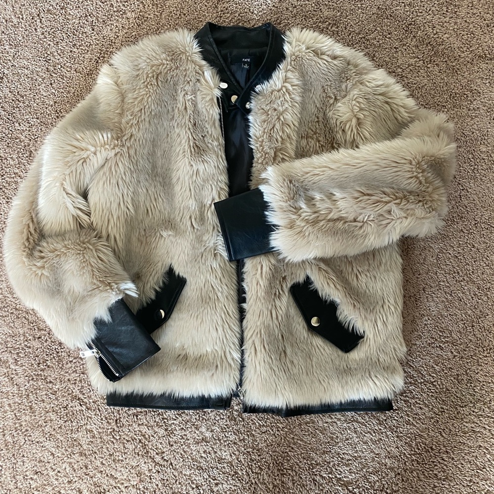 Faux fur coat with leather details on trim, pockets